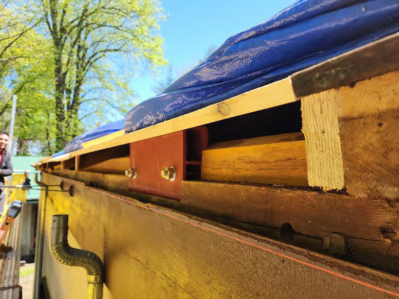 Detail of restored soffit, showing new steel reinforcement of roof truss heels.