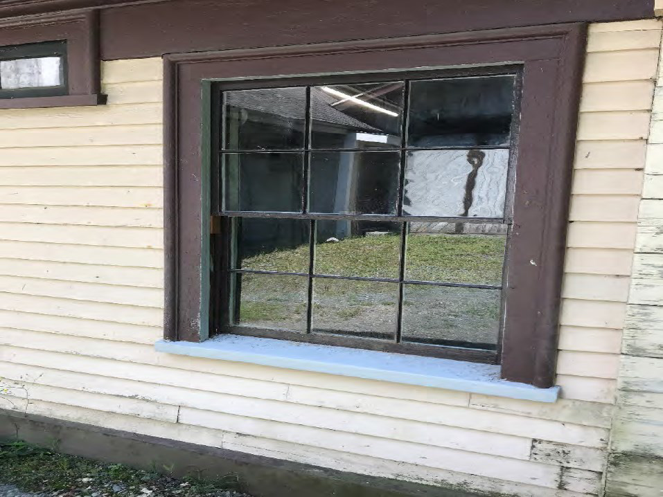 Restored window. Note color change in sash. Based on historic paint analysis, restored sill primed and to be painted in an upcoming phase.