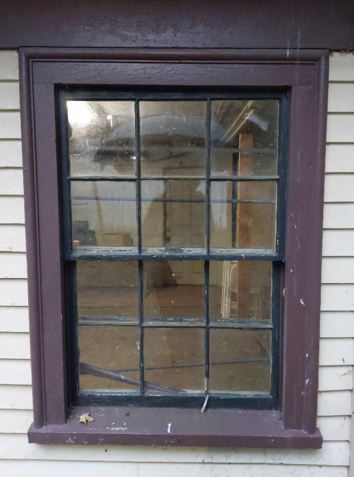 Deteriorated window prior to restoration.